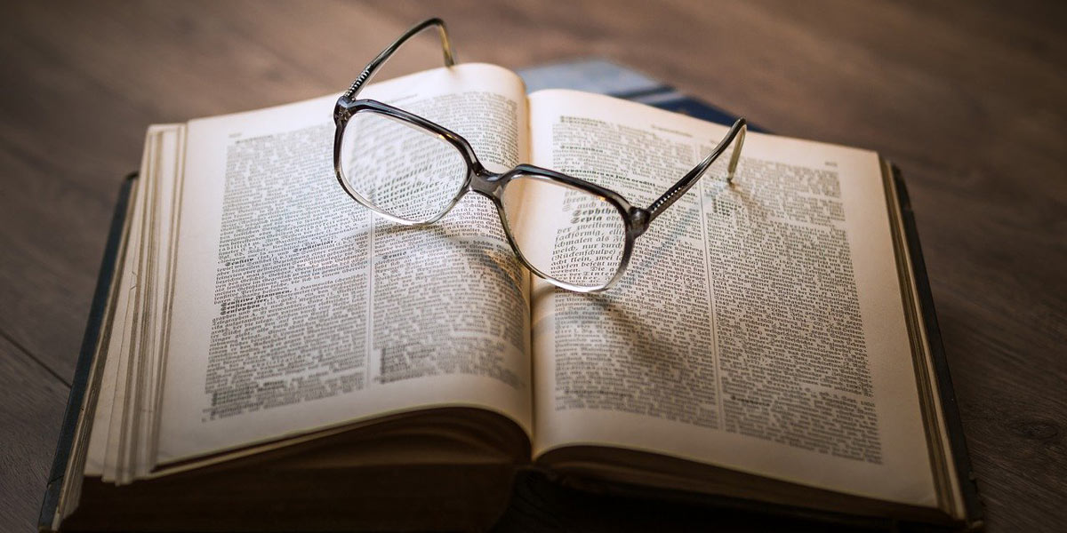 Book and reading glasses.